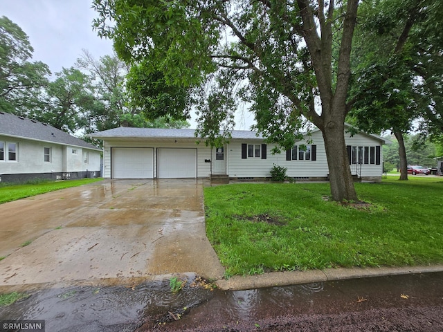 305 3rd St, Winthrop, MN 55396 - ranch-style house featuring an attached garage, concrete driveway, a front lawn, and crawl space