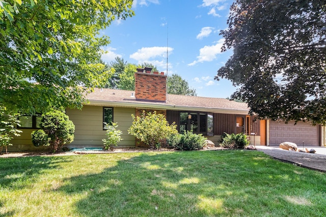 9533 Chicago Ave S, Bloomington, MN 55420 - view of front of home featuring a chimney, a front lawn, a garage, and concrete driveway