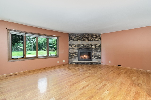 9533 Chicago Ave S, Bloomington, MN 55420 - unfurnished living room with wood finished floors and a fireplace