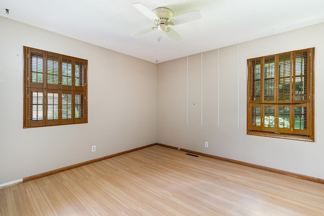 9533 Chicago Ave S, Bloomington, MN 55420 - unfurnished room featuring light wood-style flooring, healthy amount of natural light, and a ceiling fan