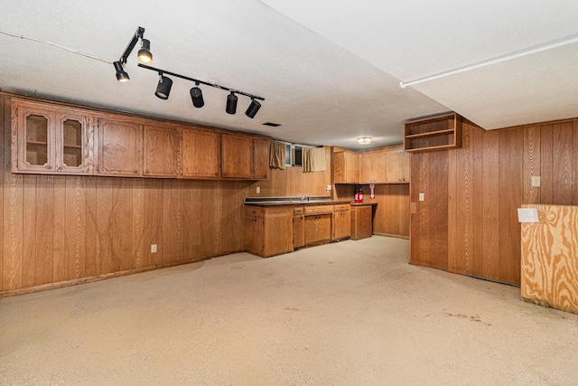 9533 Chicago Ave S, Bloomington, MN 55420 - kitchen featuring brown cabinets, wood walls, and open shelves