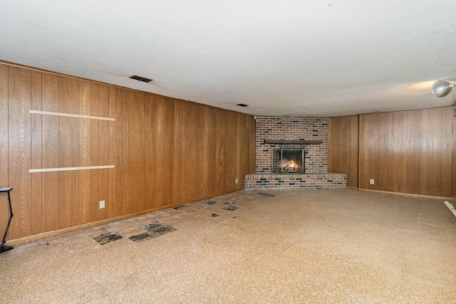 9533 Chicago Ave S, Bloomington, MN 55420 - unfurnished living room with wood walls and a fireplace