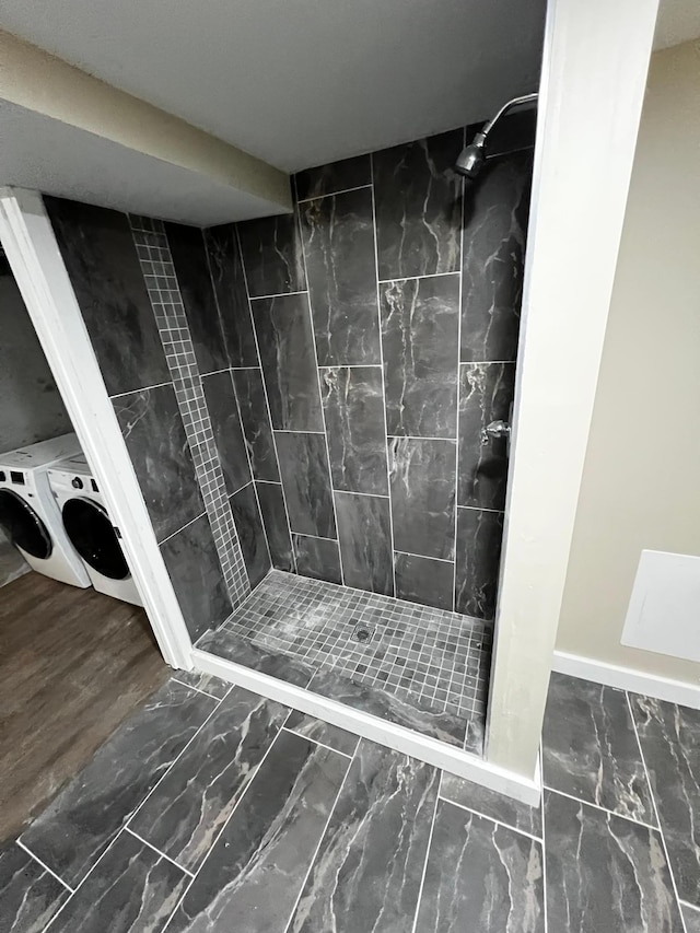 4520 Nicollet Ave, Minneapolis, MN 55419 - bathroom with washer and clothes dryer, a shower stall, and marble finish flooring