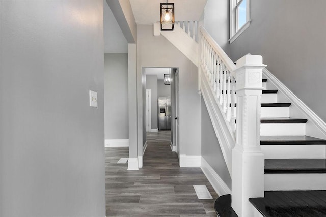 2815 Girard Ave N, Minneapolis, MN 55411 - stairway featuring wood finished floors and a high ceiling