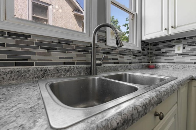 2815 Girard Ave N, Minneapolis, MN 55411 - kitchen view of tasteful backsplash, white cabinets, and light countertops