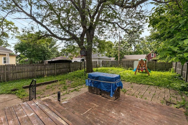 2815 Girard Ave N, Minneapolis, MN 55411 - deck with a fenced backyard and a playground