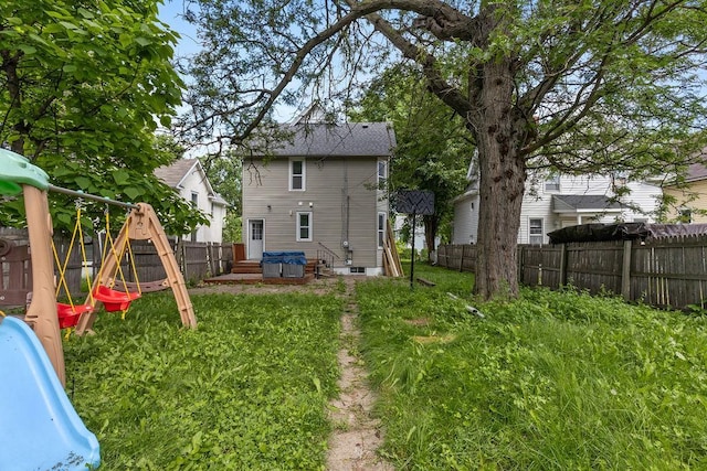 2815 Girard Ave N, Minneapolis, MN 55411 - rear view of house with a playground and a fenced backyard