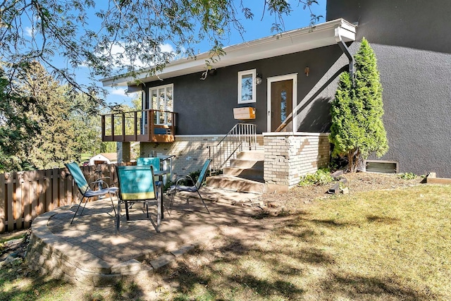 1466 Highview Ave, Eagan, MN 55121 - rear view of property featuring stucco siding and outdoor dining space