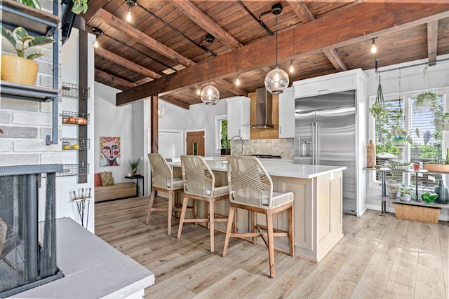 1466 Highview Ave, Eagan, MN 55121 - kitchen featuring wooden ceiling, wall chimney exhaust hood, stainless steel built in fridge, light wood-style flooring, and decorative backsplash
