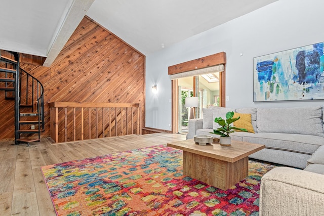1466 Highview Ave, Eagan, MN 55121 - living area with wooden walls, hardwood / wood-style floors, vaulted ceiling, and stairway