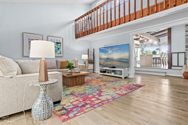 1466 Highview Ave, Eagan, MN 55121 - living area with wood finished floors, a towering ceiling, and a chandelier
