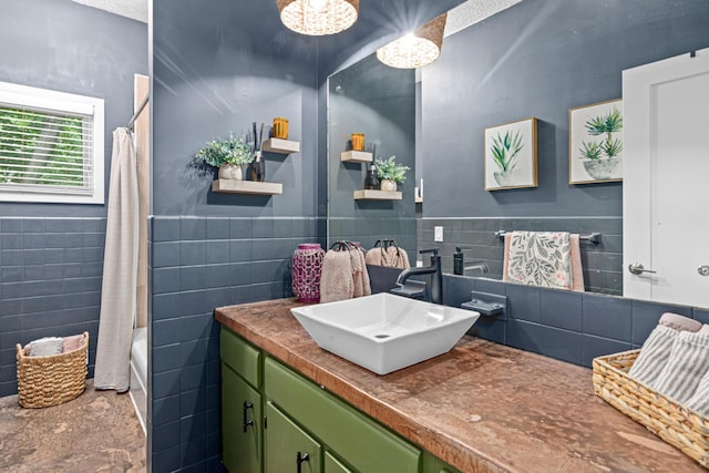 1466 Highview Ave, Eagan, MN 55121 - bathroom featuring tile walls, vanity, shower / bath combo with shower curtain, and a wainscoted wall