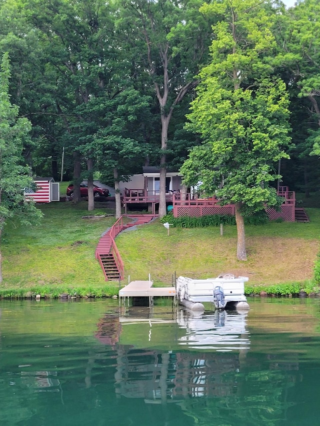 1625 Niles Ln, Balsam Lake Twp, WI 54824 - dock area with a water view, a lawn, and boat lift