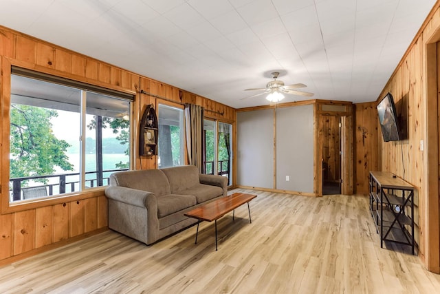 1625 Niles Ln, Balsam Lake Twp, WI 54824 - living area with wooden walls, ceiling fan, and light wood-type flooring