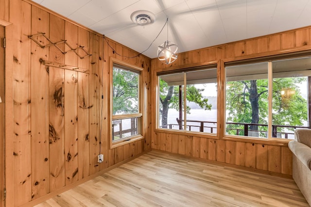 1625 Niles Ln, Balsam Lake Twp, WI 54824 - unfurnished sunroom with wooden walls and wood finished floors