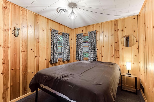 1625 Niles Ln, Balsam Lake Twp, WI 54824 - carpeted bedroom featuring wood walls and baseboards