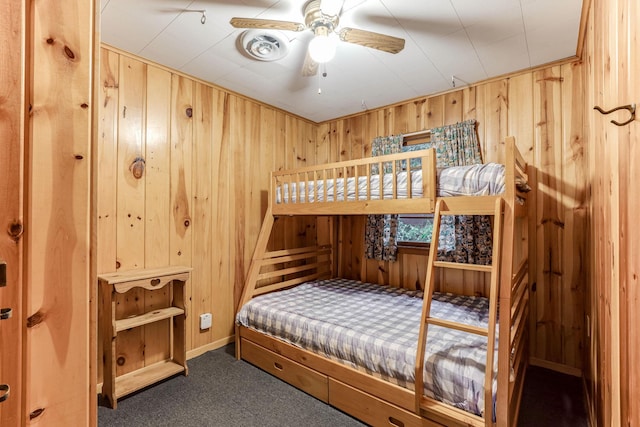 1625 Niles Ln, Balsam Lake Twp, WI 54824 - bedroom with wood walls and dark carpet