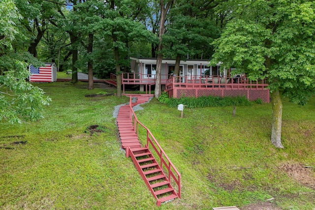 1625 Niles Ln, Balsam Lake Twp, WI 54824 - view of green lawn featuring stairway and a wooden deck