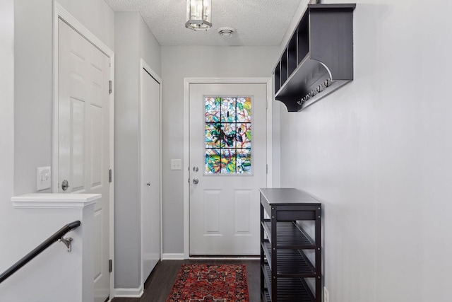 6845 Christian Curv, Woodbury, MN 55125 - entryway with a textured ceiling and dark wood-type flooring
