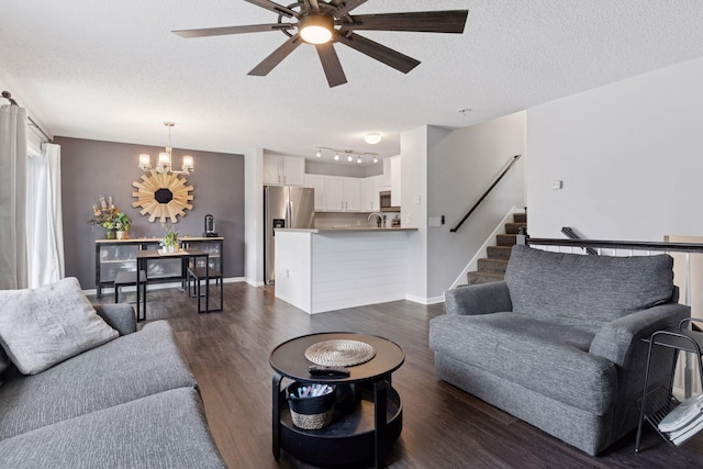6845 Christian Curv, Woodbury, MN 55125 - living area featuring a textured ceiling, a chandelier, dark wood finished floors, ceiling fan, and stairs