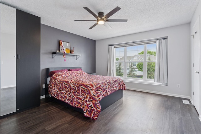 6845 Christian Curv, Woodbury, MN 55125 - bedroom with wood finished floors, a textured ceiling, and ceiling fan