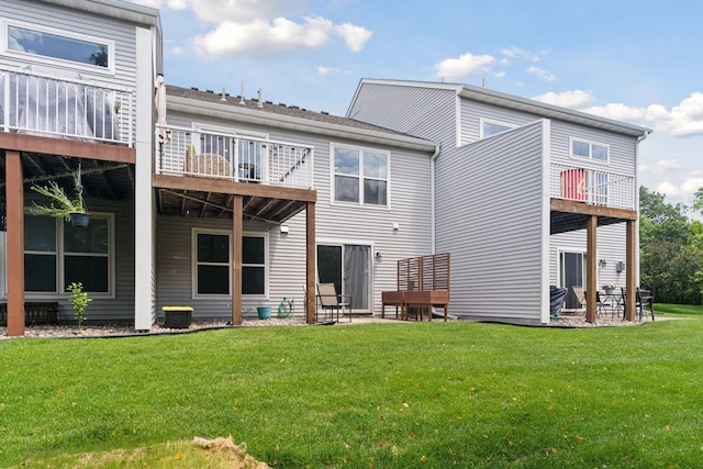 6845 Christian Curv, Woodbury, MN 55125 - rear view of house with a balcony, a yard, and a patio area
