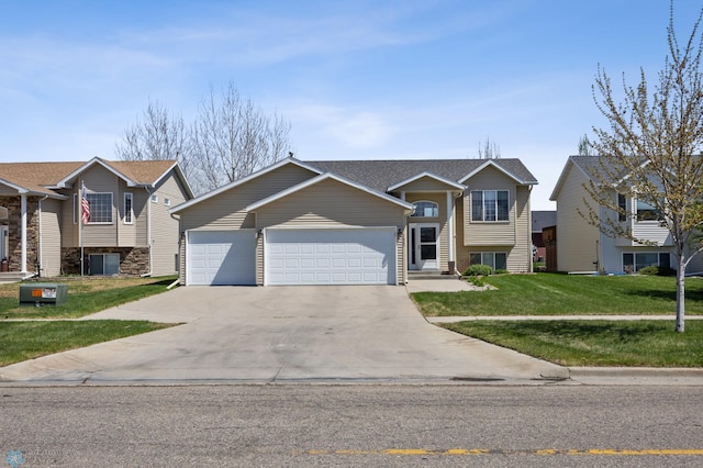 1623 10th St W, West Fargo, ND 58078 - view of front of home with a garage, concrete driveway, and a front yard
