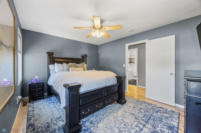 1623 10th St W, West Fargo, ND 58078 - bedroom with wood finished floors and ceiling fan