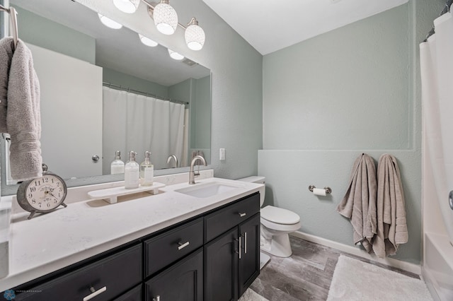 1623 10th St W, West Fargo, ND 58078 - bathroom with vanity, wood finished floors, a shower with shower curtain, and a textured wall