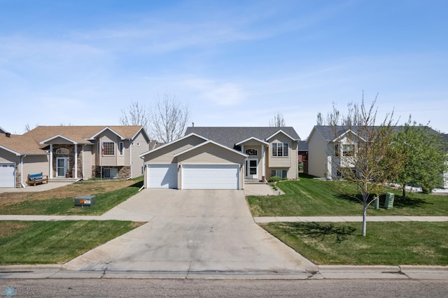 1623 10th St W, West Fargo, ND 58078 - split foyer home featuring driveway, a front lawn, and an attached garage