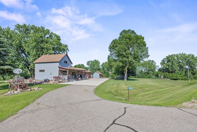 28040 Csah 25, Swede Grove Twp, MN 56243 - view of front of home with an outbuilding, a front lawn, and a garage