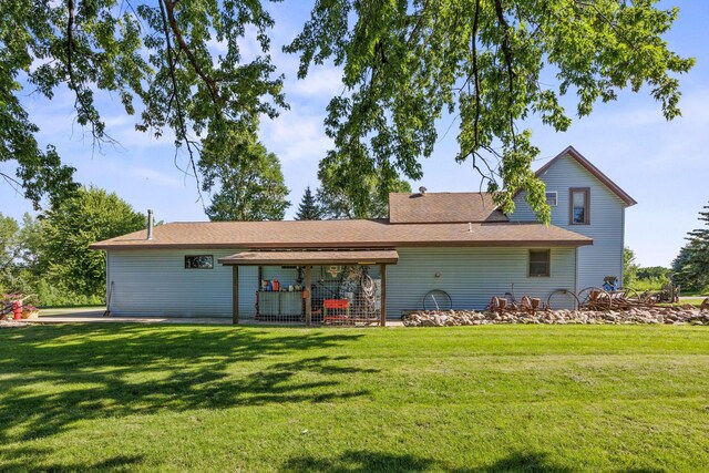 28040 Csah 25, Swede Grove Twp, MN 56243 - rear view of house with a yard and a shingled roof