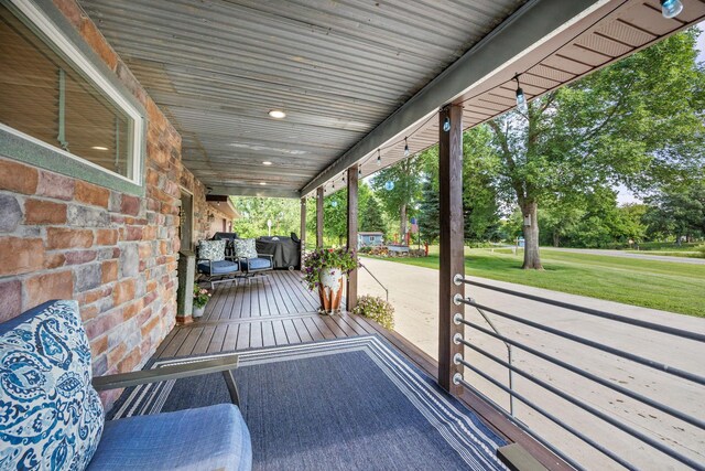 28040 Csah 25, Swede Grove Twp, MN 56243 - wooden porch featuring a lawn