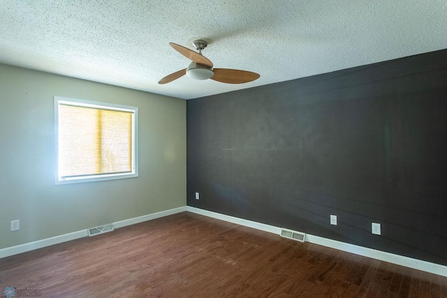 2321 17th Ave S, Fargo, ND 58103 - unfurnished room with ceiling fan, dark wood-style flooring, and a textured ceiling