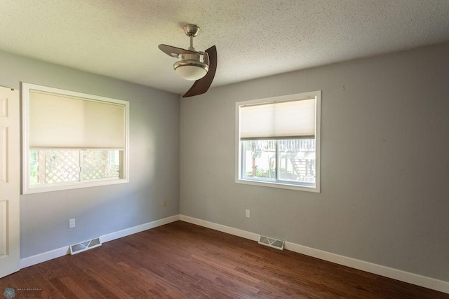 2321 17th Ave S, Fargo, ND 58103 - unfurnished room featuring a ceiling fan, dark wood-style flooring, and a textured ceiling