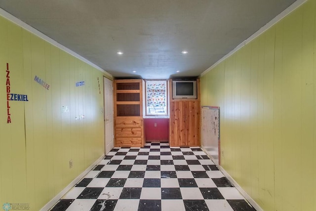 2321 17th Ave S, Fargo, ND 58103 - spare room featuring tile patterned floors, crown molding, wood walls, and recessed lighting
