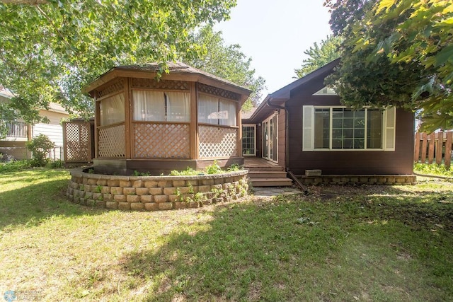 2321 17th Ave S, Fargo, ND 58103 - rear view of house with a sunroom and a wooden deck
