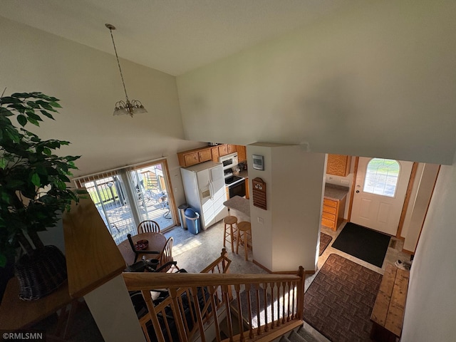 500 Albion Pl, Maple Lake, MN 55358 - staircase featuring healthy amount of natural light, high vaulted ceiling, and a chandelier
