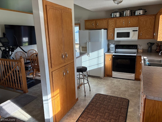 500 Albion Pl, Maple Lake, MN 55358 - kitchen with white appliances and brown cabinets