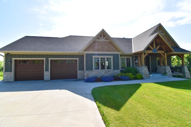 26888 734th Ave, Dassel Twp, MN 55325 - craftsman house with board and batten siding, stone siding, concrete driveway, a front yard, and a garage