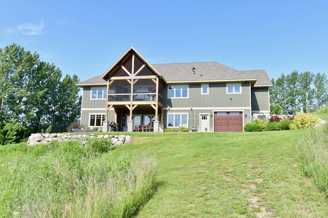 26888 734th Ave, Dassel Twp, MN 55325 - back of property featuring a sunroom, an attached garage, and a yard