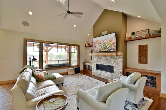 26888 734th Ave, Dassel Twp, MN 55325 - living area featuring a fireplace, a ceiling fan, wood finished floors, high vaulted ceiling, and recessed lighting