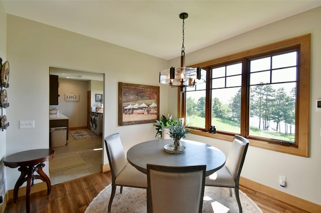 26888 734th Ave, Dassel Twp, MN 55325 - dining space featuring plenty of natural light, a chandelier, and wood finished floors