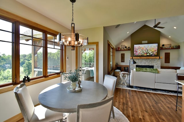 26888 734th Ave, Dassel Twp, MN 55325 - dining space with dark wood-type flooring, a chandelier, healthy amount of natural light, a stone fireplace, and recessed lighting