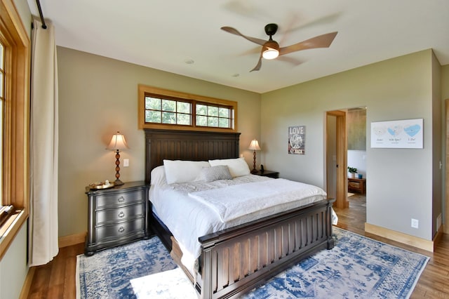 26888 734th Ave, Dassel Twp, MN 55325 - bedroom with wood finished floors and ceiling fan