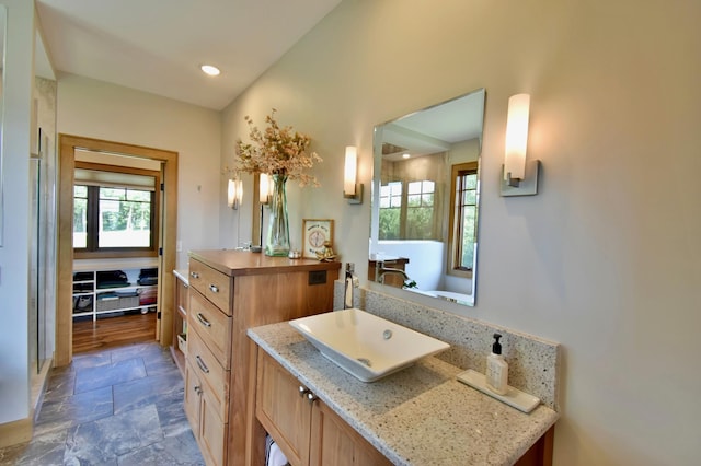 26888 734th Ave, Dassel Twp, MN 55325 - bathroom featuring stone finish floors, vanity, and recessed lighting
