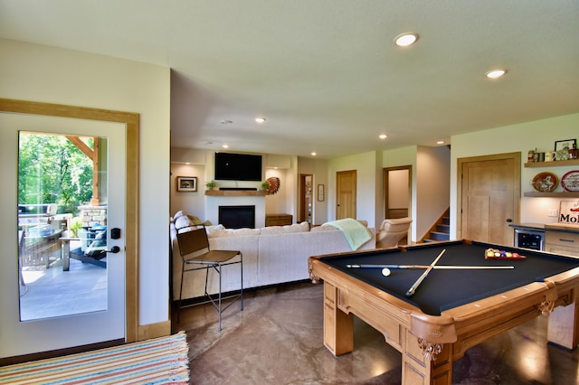 26888 734th Ave, Dassel Twp, MN 55325 - game room with a fireplace, concrete flooring, and recessed lighting