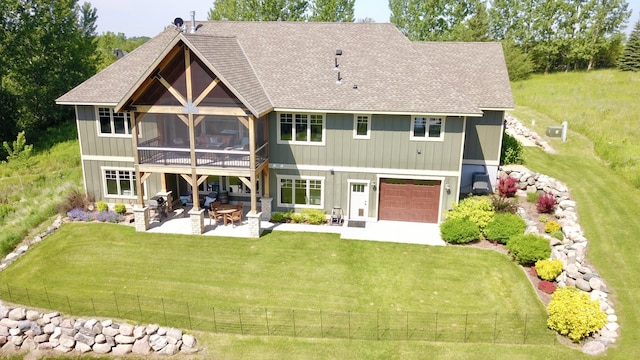 26888 734th Ave, Dassel Twp, MN 55325 - back of property featuring a shingled roof, a patio area, a yard, and a sunroom