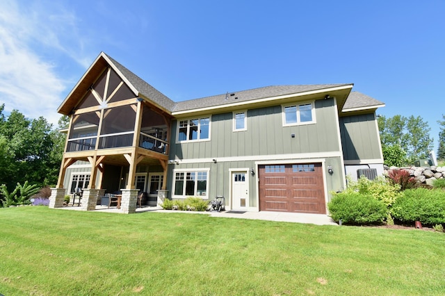 26888 734th Ave, Dassel Twp, MN 55325 - back of house featuring a yard, a garage, a patio, and roof with shingles