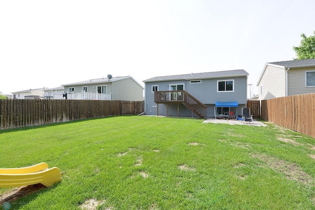 2441 60th Ave S, Fargo, ND 58104 - rear view of property with stairs, a fenced backyard, a patio area, and a deck